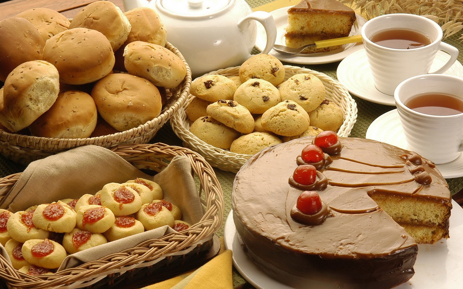 food sweet sweet table cake chocolate cherry strawberry buns cookies raisins cake piece of cake cup mug tea coffee baskets napkin