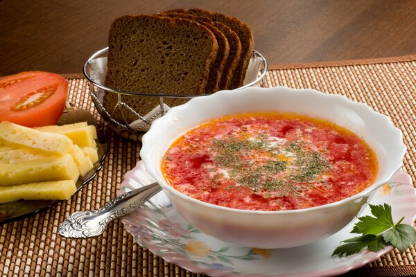 Exquisite borscht with sour cream and herbs