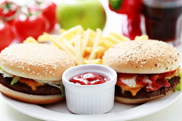 Hamburgers and fries on a plate