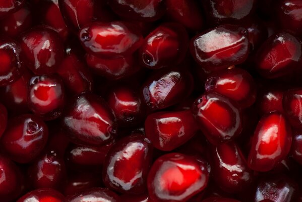 A scattering of red pomegranate seeds