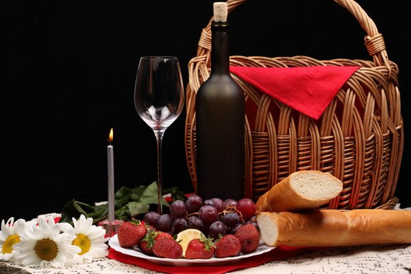 Evening dinner romantic flowers basket baguette fruit wine glass