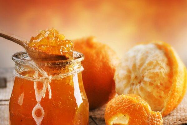 A jar of orange oranges jam