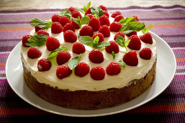 Sponge cake decorated with raspberries