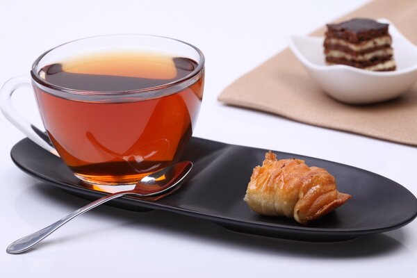 A cup of fragrant tea with a piece of krupsan attached