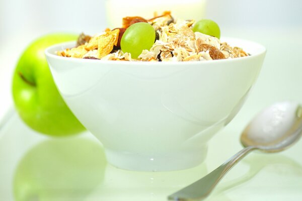 Muesli with grapes in a plate on the table