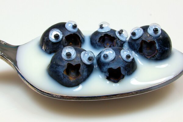 Blueberries in a spoonful of cream