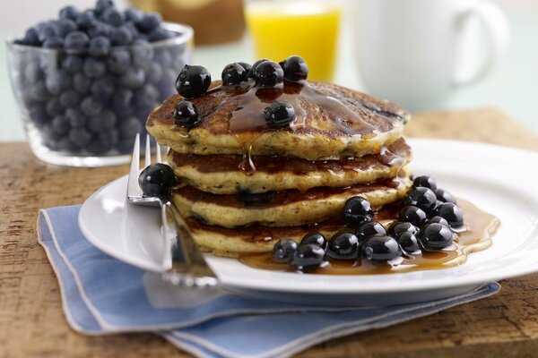 Pancakes with blueberries and honey