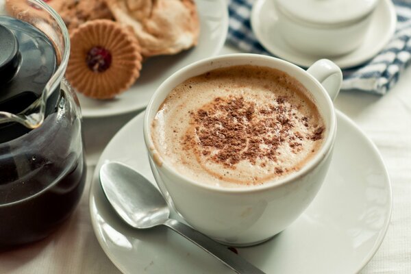 A cup of fragrant coffee with cream