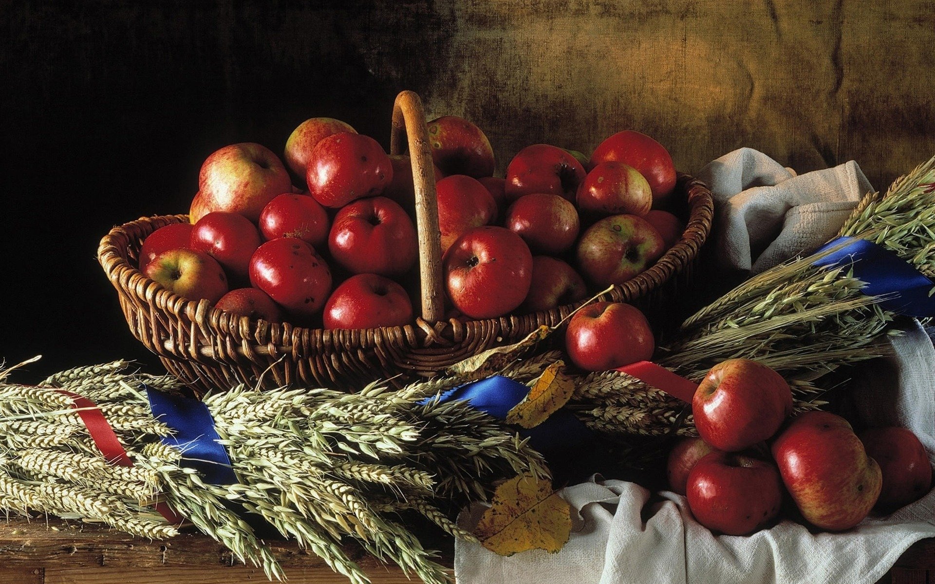 nature morte rouge pommes osier panier