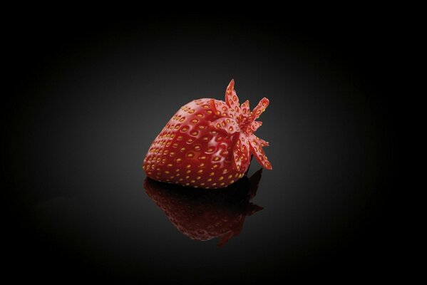 Red , juicy strawberries on a black background