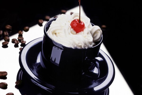 Whipped cream with cherries on the table