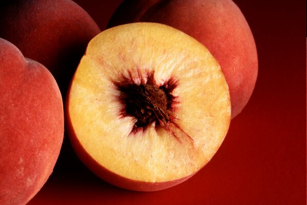 A close-up photo of a peach cut