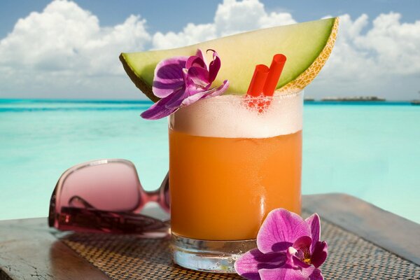 Tropical drink on the background of the sea