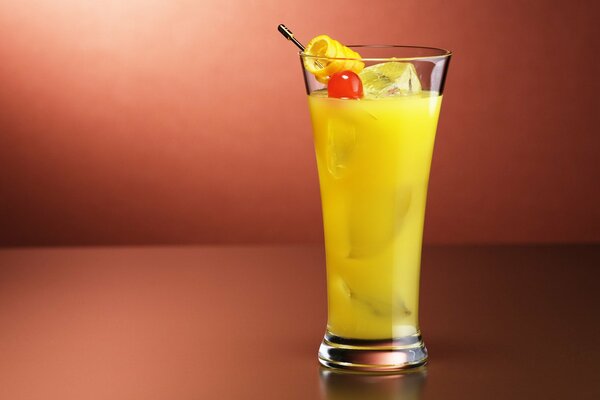 Orange cocktail on a solid background