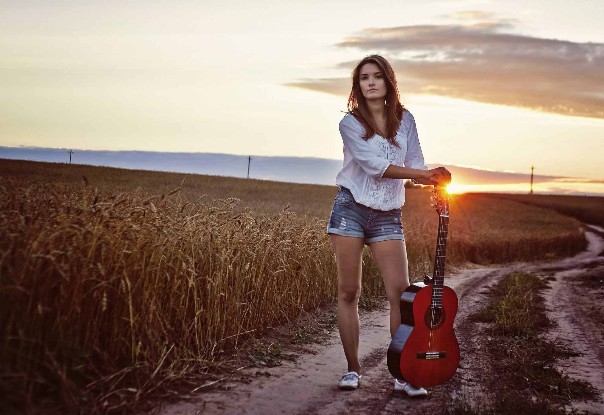 girl guitars sunset