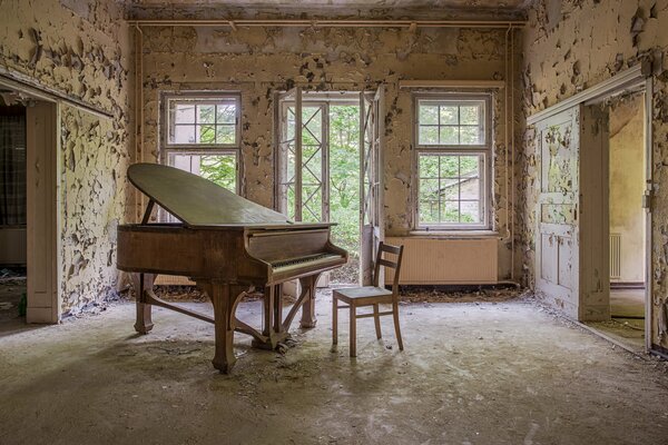 Piano in an empty abandoned room