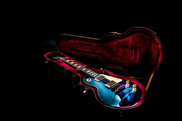 Guitar in a red velvet case