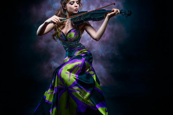 An unusual photo shoot of a violinist in dark colors