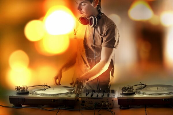 DJ with records and headphones and bokeh