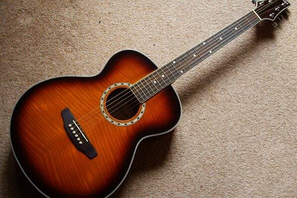 Guitar on beige background