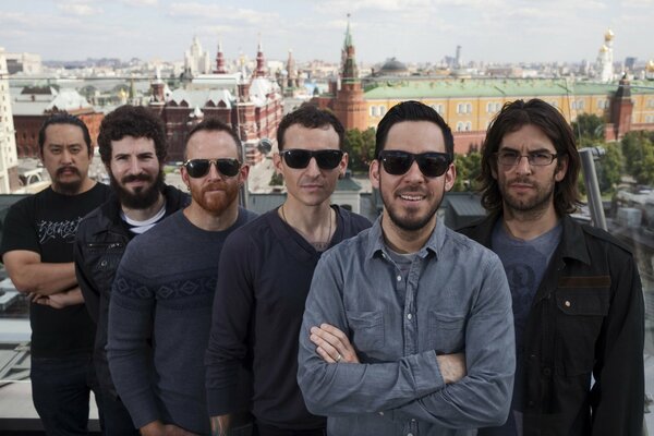 Members of Linkin Park against the background of the Moscow Kremlin