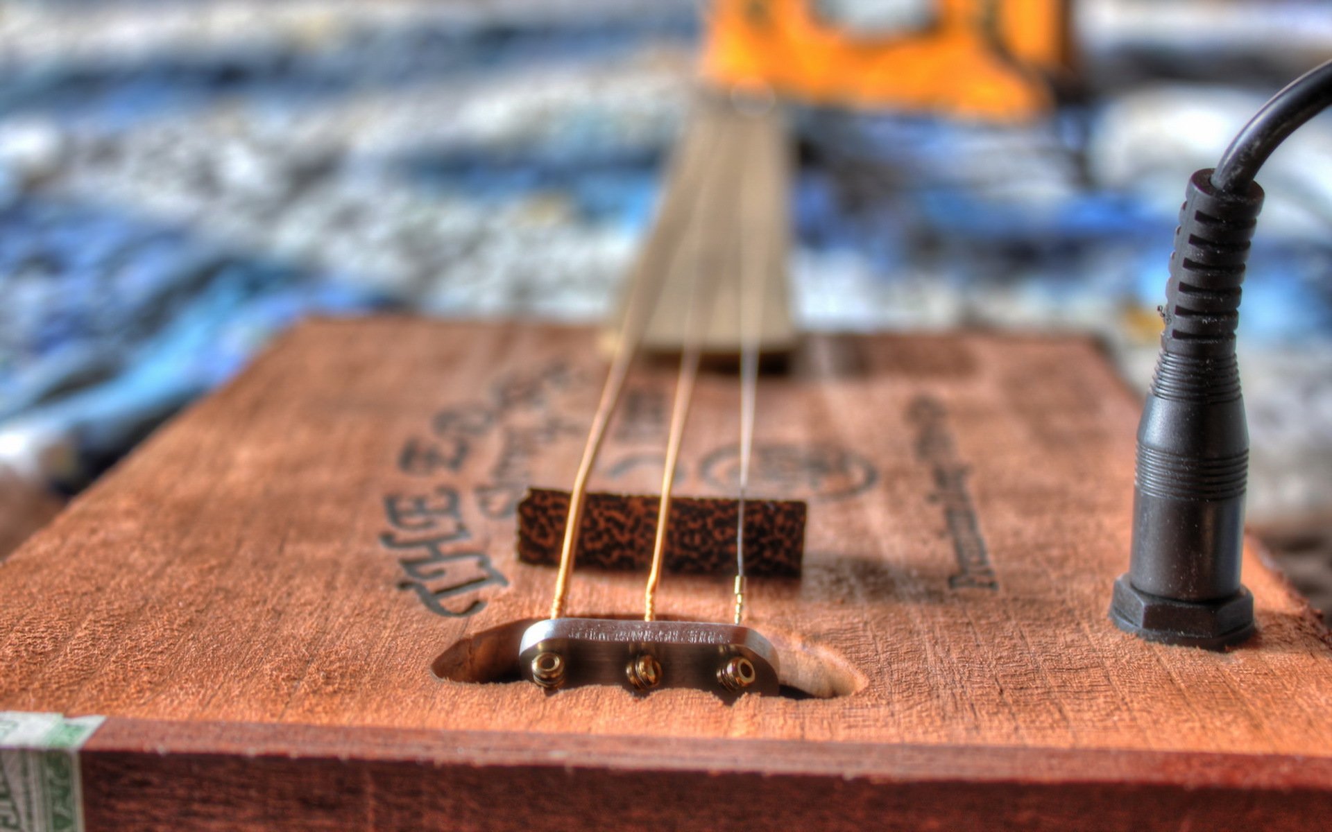 cigar box guitarra bokeh música