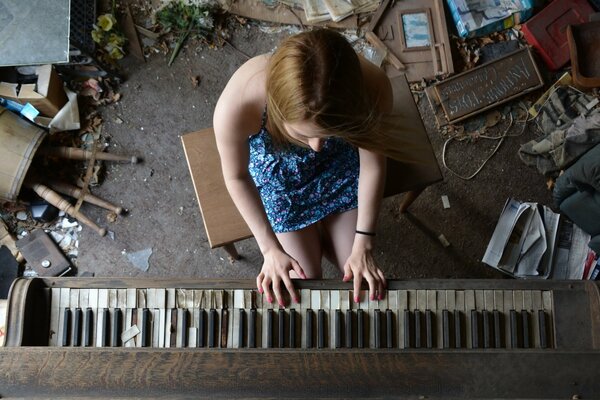 A girl plays the piano