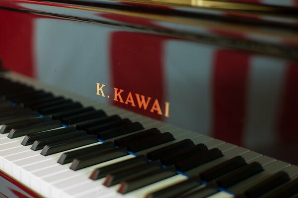 Wooden piano with open keyboard