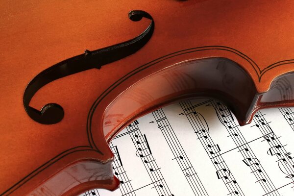 Violin and sheet music. Music notebook