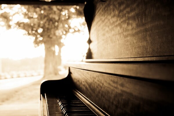 Piano on a blurry background. sepia