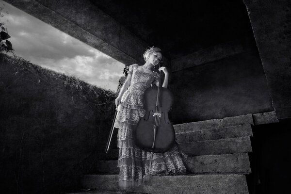 Staged photo with a cello. Girl model