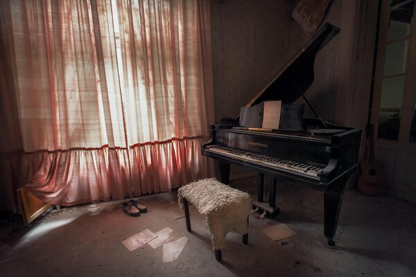 An old room with a beautiful grand piano