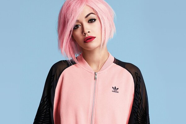 Rita Ora with pink hair in an adidas suit