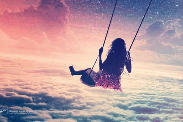 Girl on a swing against the sky