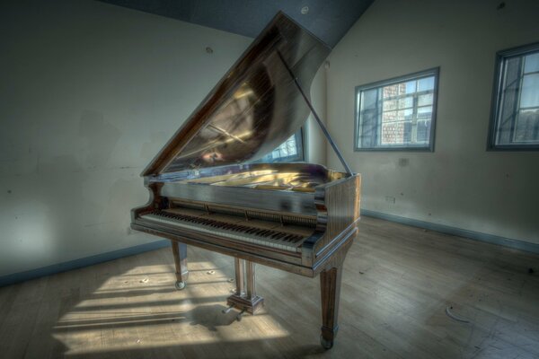 A lonely piano in an empty room