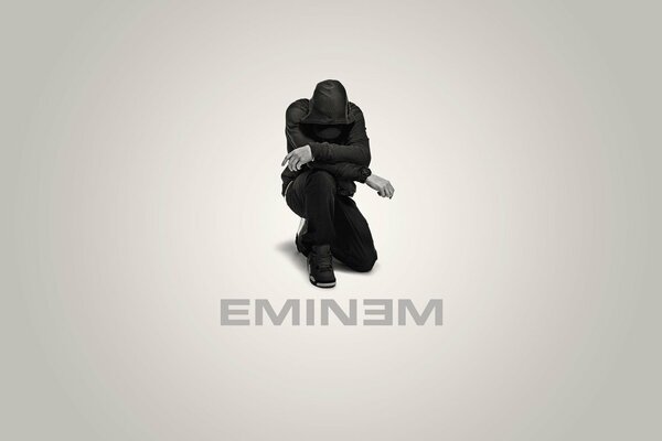 Portada del álbum de Eminem arrodillado en marrón