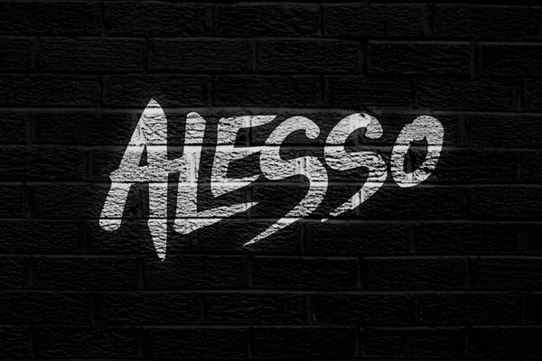 Black brick wall with the inscription alesso