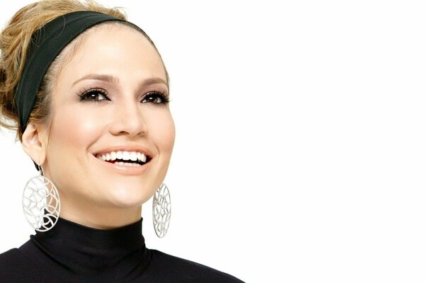 Singer Jennifer Lopez with makeup and a smile