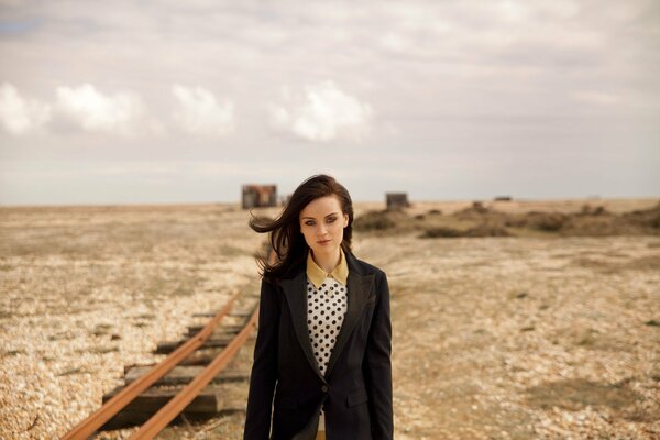 Beautiful girl near the railway