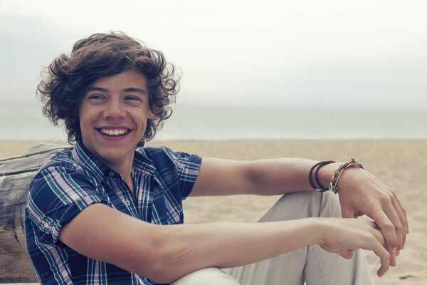 Smiling Harry Styles in the desert