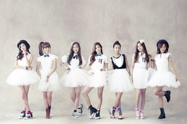 Girls from the Korean kpop group in tutus and sneakers