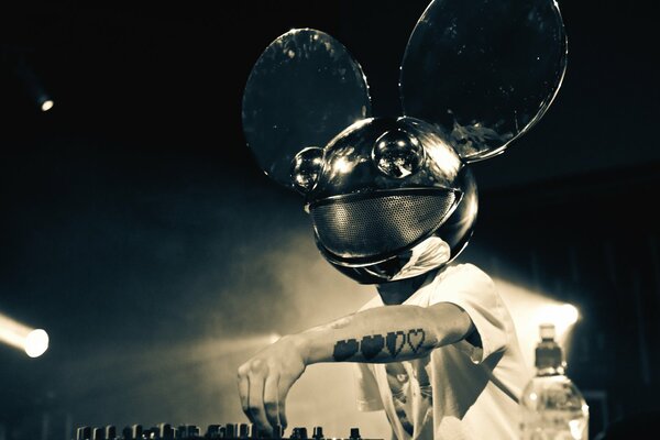 DJ with a Mickey Mouse mask in the club