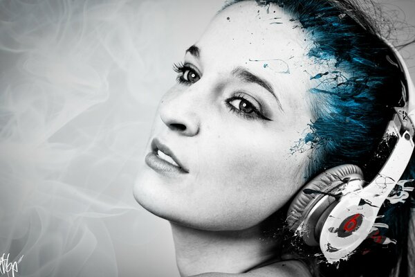 A girl with headphones listens to music