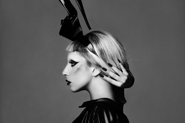 Lady Gaga with a shoe on her head