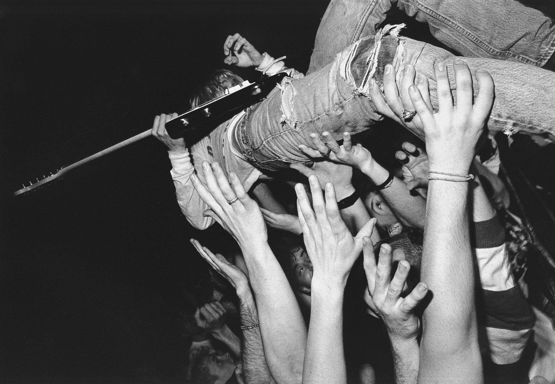 kurt cobain guitars slam hands crowd musician