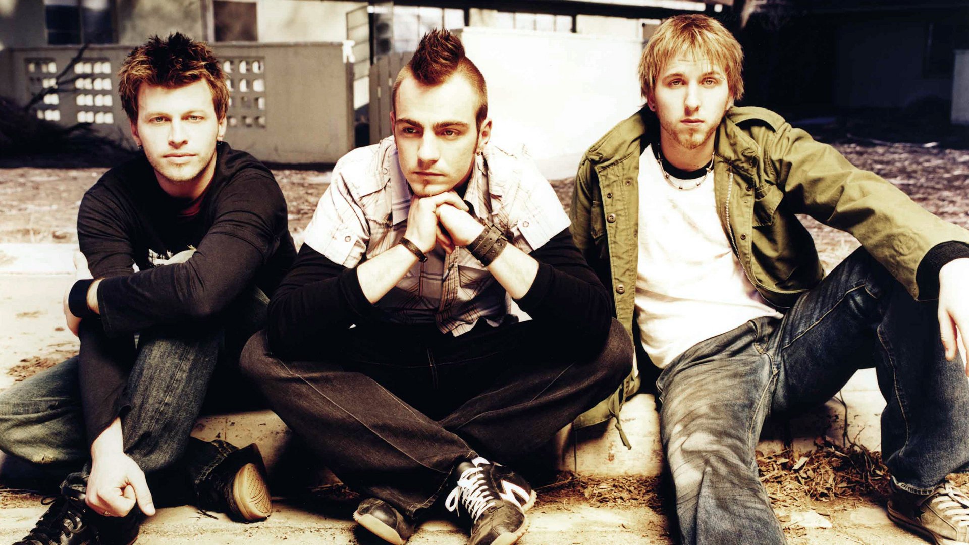 three dace grace man sitting adam gontier neil sanderson brad walst