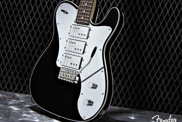 Electric guitar in black and white on a black background