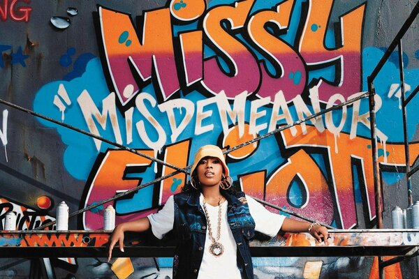 Rapper Missy Elliot on the background of graffiti