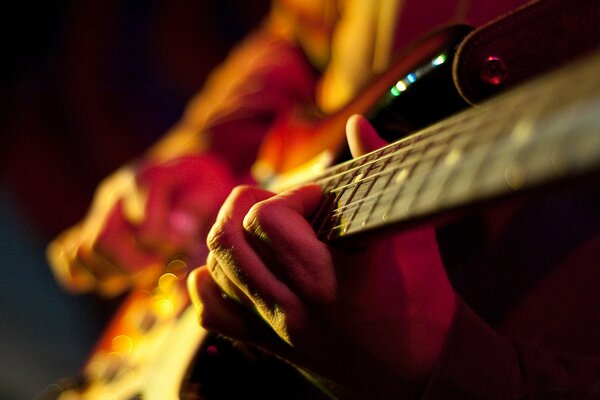 Men s hands and guitar