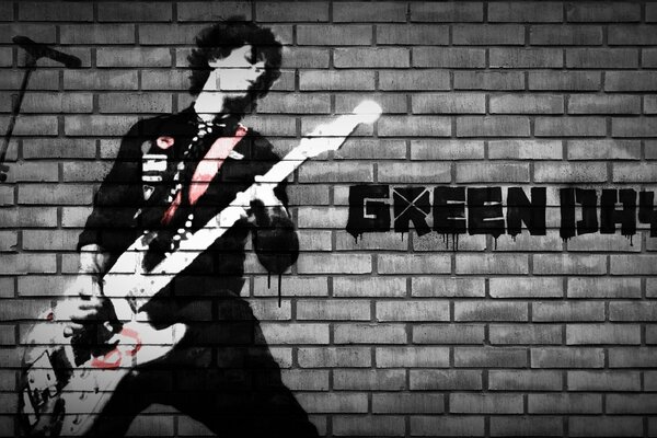 Sänger der Band Green Day mit Gitarre